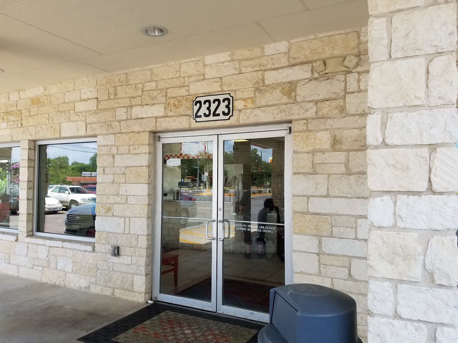 Front entrance of T J's Hamburgers with limestone facade